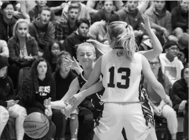  ?? JULIE JOCSAK
THE ST. CATHARINES STANDARD ?? Saint Paul’s Angeline Galati shoots the ball past Sir Winston Churchill defender Ally Sentance at the Standard Girls High School Basketball Tournament in St. Catharines.