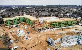  ?? JAY JANNER / AMERICAN-STATESMAN ?? Edison, an apartment project, is under constructi­on at 4711 East Riverside Drive. In five years, the region’s supply of apartment units has ballooned by more than 28 percent, including 10 percent in the past 24 months, figures show.