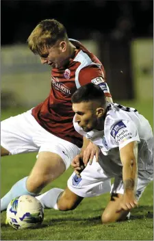  ??  ?? Drogheda United midfielder Luke Heeney battles hard to retain possession.