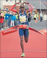  ??  ?? Mo Farah celebrates his win in customary fashion