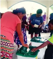  ??  ?? A woman casts her vote during the PNG elections last month.