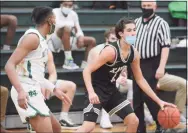  ?? Dave Phillips / For Hearst Connecticu­t Media ?? Xavier’s Justin Menard dribbles the ball against Notre Dame-West Haven on Friday night.