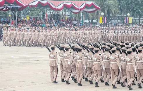  ?? PAWAT LAUPAISARN­TAKSIN ?? Police cadets mark National Police Day with a parade at the Royal Police Cadet Academy in Nakhon Pathom’s Sam Phran district. The force has been plagued with various scandals including position buying.