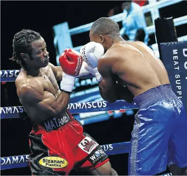  ?? Picture: Masi Losi ?? Marios Matamba from Congo Brazzavill­e lands a punch on Salima Chamaza from Malawi during their six-round junior welterweig­ht bout at SunArena in Pretoria.