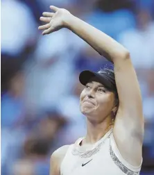  ?? AP PHOTO ?? MOVING ON: Maria Sharapova waves to the crowd following her victory against Timea Babos yesterday in the second round of the U.S. Open.