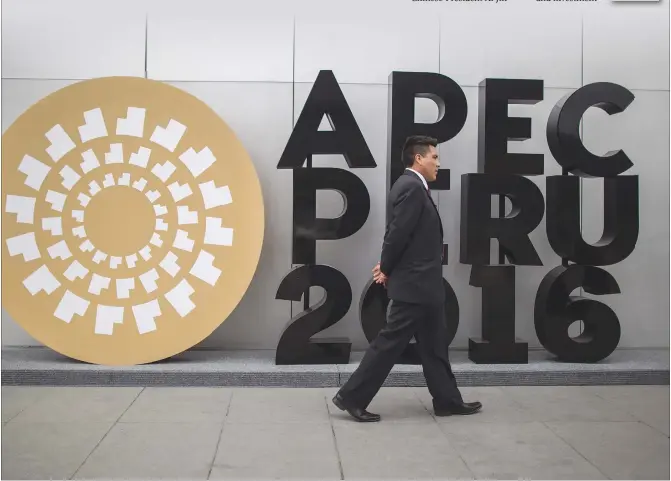  ?? Photo: IC ?? A man walks past an APEC PERU 2016 sign in front of the Lima Convention Center during the Asia-Pacific Economic Cooperatio­n (APEC) meeting in Lima, Peru on Friday. World leaders from the 21 member economies will gather at the meeting on Saturday and Sunday.