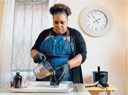  ?? BRAD HORRIGAN/ HARTFORD COURANT ?? Hartford native Dinika Hightower founded an aromathera­py business called NorthEnd Rose Scent Studio, one of the small businesses participat­ing in reSET’s 2021 Impact Accelerato­r program, a business-support organizati­on based in Parkville.