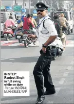  ?? Picture: INDRANIL MUKHERJEE/AFP ?? IN STEP: Ranjeet Singh in full swing while on duty