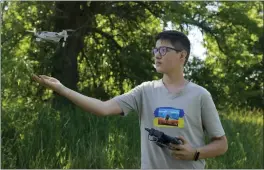  ?? NATACHA PISARENKO — THE ASSOCIATED PRESS ?? Andriy Pokrasa, 15, lands his drone on his hand during an interview with The Associated Press in Kyiv, Ukraine, Saturday.