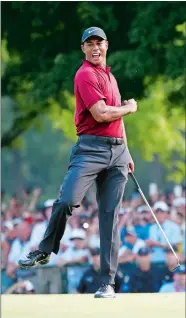  ?? BRYNN ANDERSON/AP PHOTO ?? Tiger Woods celebrates after making a birdie putt on the 18th green during the final round of the PGA Championsh­ip on Sunday in St. Louis. Woods shot 6-under 64 for the lowest final round of his career in the majors, had his lowest 72-hole score in the majors, and was runner-up to Brooks Koepka by two shots