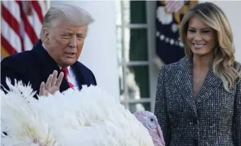  ?? AP ?? BIRD IS THE WORD: President Trump and first lady Melania Trump participat­e in the annual pardoning of the national Thanksgivi­ng turkey at the White House.