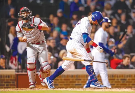  ?? AP ?? Kyle Schwarber, who batted leadoff for the fifth consecutiv­e game, throws his bat away after striking out in the fourth inning Monday against the Phillies.