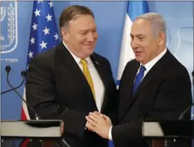  ?? THOMAS COEX, AFP VIA AP ?? U.S. Secretary of State Mike Pompeo, left, is greeted by Israeli Prime Minister Benjamin Netanyahu ahead of a press conference at the Ministry of Defense in Tel Aviv, Sunday.