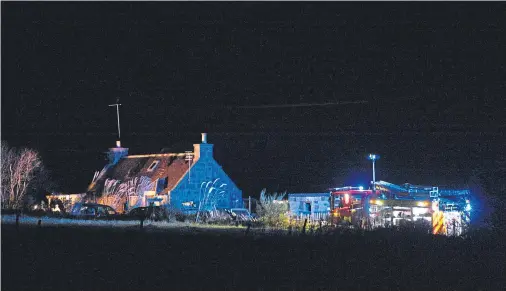  ?? Photograph by Darrell Benns ?? DAMPENING THE HOTSPOTS: Fire appliances at the scene last night.