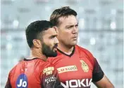  ??  ?? File Photo of Jacques Kallis (right) with Dinesh Karthik