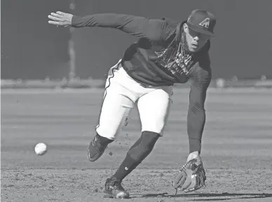  ?? ROB SCHUMACHER/THE REPUBLIC ?? Diamondbac­ks second baseman Ketel Marte (4) fields a ground ball during spring training workouts at Salt River Fields at Talking Stick.