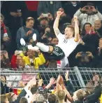  ??  ?? Teammates throw Germany’s midfielder Lukas Podolski in the air after the friendly football match of Germany vs England in Dortmund, western Germany, on Marcht 22, 2017. It is Lukas Podolski’s last match with the German team. - AFP photo