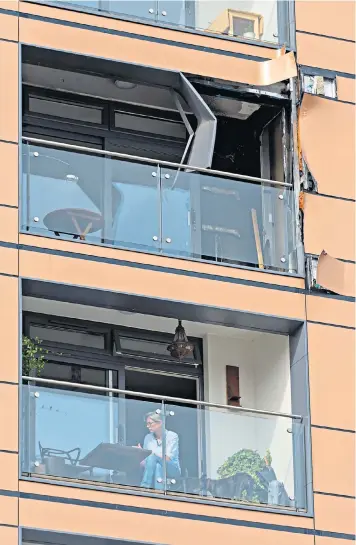  ??  ?? Fire-damage on the sixth floor of Sesame Apartments, Battersea. Residents face bills of £60,000 per flat to replace the cladding