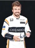  ?? — AFP photo ?? McLaren's Spanish driver Fernando Alonso poses for a photo in Melbourne on March 23, 2017, ahead of the Formula One Australian Grand Prix.