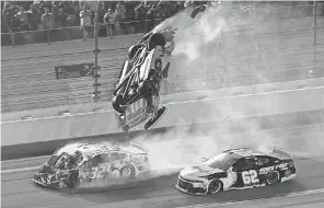  ?? CHRIS GRAYTHEN/ GETTY IMAGES ?? Ryan Newman’s No. 6 car flips over as he crashes during the Daytona 500 last February.