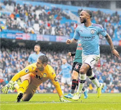  ??  ?? Manchester City’s Raheem Sterling, right, scores his team’s first goal against Aston Villa at the Etihad Stadium.