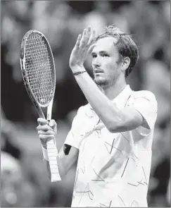  ?? CLIVE BRUNSKILL/GETTY ?? Daniil Medvedev celebrates after his 7-6 (5), 6-4, 6-3 semifinal victory Friday.