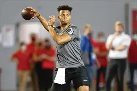  ?? PAUL VERNON / ASSOCIATED PRESS ?? Ohio State quarterbac­k Justin Fields throws during his pro day workout in Columbus on March 30. The two-time Big Ten Offensive Player of the Year and Heisman finalist did not miss a game over two seasons while leading OSU.