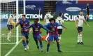  ??  ?? Crystal Palace’s Jeffrey Schlupp (No 15) leads the celebratio­ns after scoring the equaliser at Selhurst Park. Photograph: Glyn