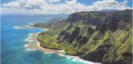  ??  ?? COURTESY PHOTO PARADISE: The dramatic NaPali Coast on the island of Kauai is one of the reasons Hawaii is a popular destinatio­n for honeymoone­rs.