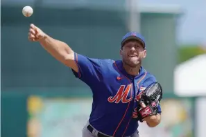  ?? The Associated Press ?? ■ New York Mets’ Max Scherzer pitches in the second inning of a spring training baseball game against the Miami Marlins Monday in Jupiter, Fl.