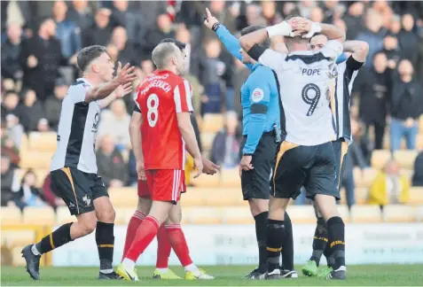  ??  ?? PENALTY REF: Port Vale’s Luke Hannant appeals for a penalty, but only a corner was given by the referee. Pictures: Pete Stonier