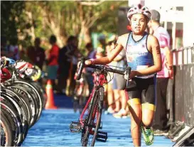  ?? KEITH BACONGCO ?? HANDA para sa bike event ang batang kalahok sa ginanap na Alaska Ironkids triathlon championsh­ip kahapon sa Davao City.