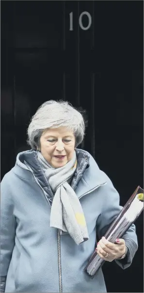  ?? PICTURE: DAN KITWOOD/GETTY IMAGES ?? POLITICAL DRAMA: Prime Minister Theresa May outside 10 Downing Street yesterday. The first day of debate on her EU Withdrawal Agreement saw her suffer her second defeat in 24 hours.