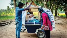  ?? AP ?? Phagni Poyam, 23, sits inside a motorbike ambulance outside her home in the village of Kodoli, in Chhattisga­rh.