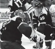  ?? David Zalubowski, The Associated Press ?? Colorado Avalanche goaltender Semyon Varlamov, left, stops a shot off the stick of Dallas Stars center Jason Dickinson, right, as Colorado defenseman Samuel Girard looks for a rebound Saturday, in Denver.