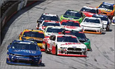  ?? Associated Press ?? Get loose: Ross Chastain (7) leads as Cole Custer (00) gets loose on a restart of a NASCAR Xfinity Series auto race on Saturday in Bristol, Tenn..