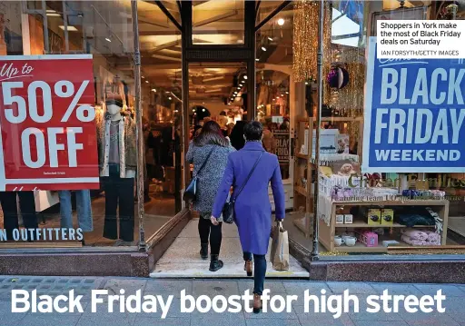  ?? IAN FORSYTH/GETTY IMAGES ?? Shoppers in York make the most of Black Friday deals on Saturday