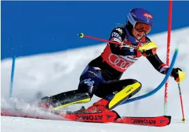  ?? ALESSANDRO TROVATI/THE ASSOCIATED PRESS ?? The United States’ Mikaela Shiffrin speeds down the course Sunday during the women’s World Cup slalom in Are, Sweden. Shiffrin dominated the season’s penultimat­e slalom for career win 96 and locked up her record-equaling eighth season title.