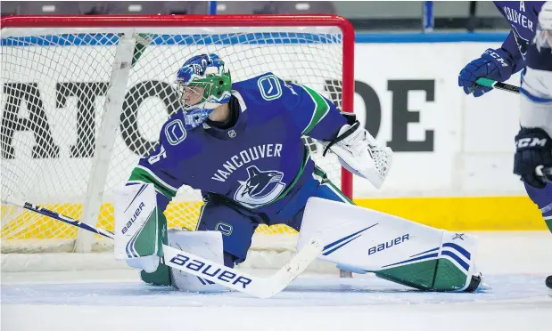  ?? BOB FRID/PNG ?? Canucks goalie Michael DiPietro makes a save against the Jets during the Young Stars Classic at the South Okanagan Events Centre on Friday night. DiPietro is expected to grab the job as Canada’s starting goalie at this year’s world junior championsh­ip.