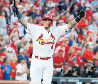  ?? CURTIS COMPTON/TNS ?? Yadier Molina celebrates after hitting a walk-off sacrifice fly in the Cardinals’ win Monday.