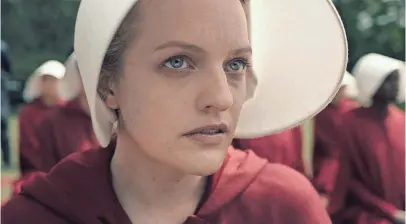  ?? HULU ?? Elisabeth Moss plays Offred, one of the few remaining fertile women in the future United States.