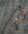  ?? PHILIPPINE STAR_KJ ROSALES ?? WORKERS inspect railway tracks of the Manila Metro Rail Transit in Pasay City.