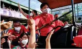  ?? AFP ?? Ferdinand Marcos Jr., presidenti­al candidate, greets supporters during a recent rally in Las Pinas City, suburban Manila.