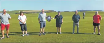  ??  ?? David MacBrayne and Linda Arkell, winners of Dunaverty Golf Club’s Mixed Pairs competitio­n, centre, with second placed Steven Garrett and Susan McLennan, left, and third placed Donald Brown and Sophie Garrett, right.