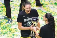  ?? CHRIS O'MEARA AP ?? Seattle’s Breanna Stewart (left) and Sue Bird celebrate Tuesday after winning the WNBA Finals over Las Vegas.