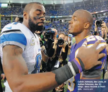  ?? PHOTO AFP ?? Calvin Johnson, des Lions, et Adrian Peterson, des Vikings : deux records à l’horizon.