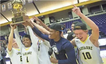  ?? PHOTOS BY GEORGE WALKER IV / THE TENNESSEAN ?? Lausanne players celebrate winning the Division 2-A state basketball championsh­ip game over Franklin Road Academy on March 4.