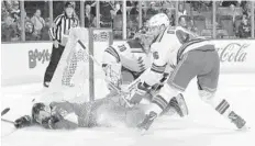  ?? JOEL AUERBACH/GETTY IMAGES ?? The Rangers’ Rob O’Gara gets an interferen­ce penalty for taking down Michael Matheson of the Panthers near the goal Saturday night in Sunrise.