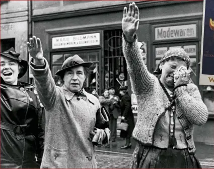  ??  ?? LEFT: Residents of a Sudetenlan­d town greet German troops in October 1938. The Munich agreement had seen Britain giving its assent to the Nazi absorption of German-speaking areas of Czechoslov­akia