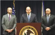  ?? Arkansas Democrat-Gazette/THOMAS SACCENTE ?? Duane “DAK” Kees (center), U.S. attorney for the Western District of Arkansas, speaks Tuesday as Clay Fowlkes (left), first assistant U.S. attorney for the Western District of Arkansas, and Justin King, assistant special agent in charge of the Drug Enforcemen­t Administra­tion in Arkansas, listen during a news conference Tuesday in Fort Smith.